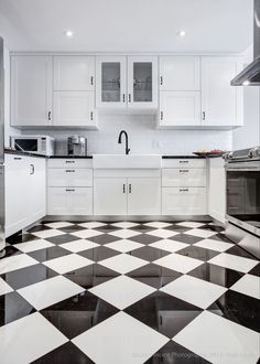 a black and white checkered floor in a kitchen