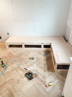 the room is being remodeled and ready to be used as a work area for furniture