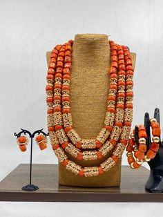 Handcrafted African Coral Beads Necklace - Unique Ethnic Jewelry for a Statement Look Materials: 1. Natural/Original African Coral bead 2. Gold color accessories  3. This listing contains 3 layers of necklace, 2 bracelets and a set of earrings. Length of Necklace: 16 - 20inches Colour of Accessories: Gold   Description: 🌍 African Elegance: Immerse yourself in the rich cultural tapestry of Africa with this exquisite necklace. Each vibrant coral bead tells a story of tradition, craftsmanship, and Bohemian Jewelry With Polished Beads For Traditional Ceremonies, Handmade Jewelry For Traditional Ceremonies And Festivals, Traditional Beaded Jewelry For Ceremonies, Handmade Jewelry For Traditional Ceremonies, Bohemian Orange Necklace For Wedding, Traditional Jewelry With Colorful Round Beads, Traditional Large Beads Jewelry For Ceremonies, Traditional Round Beads Jewelry For Ceremonies, Traditional Jewelry With Large Beads For Ceremonies