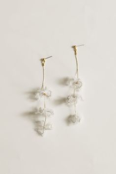 Adina Strand Earrings by A.B. ELLIE Bridal Accessories — A.B. ELLIE Delicate Bridal Earrings For Party, Delicate Flower Bridal Earrings For Party, Delicate Chandelier Earrings For Party, Clear Dangle Earrings For Wedding, White Flower Earrings For Celebration, Delicate Dangle Bridal Earrings For Evening, Wedding Jewelry With Matching Clear Earrings, Dangle Flower Earrings For Wedding, Wedding Dangle Flower Earrings