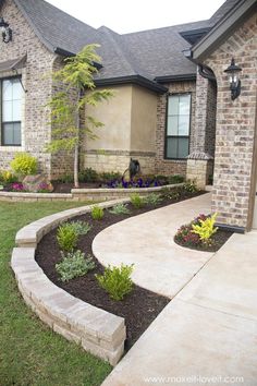 a house with landscaping in front of it