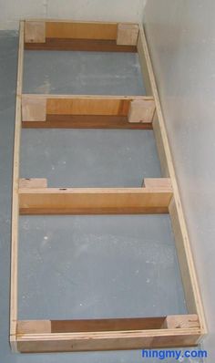 three wooden shelves sitting on top of each other