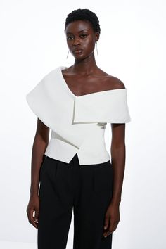 Cheap Asymmetrical Hem Tops For Workwear, Luxury Custom Fit Tops For Semi-formal Occasions, Luxury Formal Tops With Asymmetrical Hem, Luxury Asymmetrical Hem Blouse For Formal Occasions, Luxury Asymmetrical Hem Blouse For Women, Luxury Women's Blouse With Asymmetrical Hem, Luxury Summer Tops With Asymmetrical Hem, Luxury Summer Blouse With Asymmetrical Hem, Luxury Elegant Form-fitting Bottoms