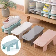 three different colored foot stools in front of a shoe rack with shoes on it