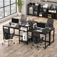 an office with desks, chairs and shelves on the floor in front of a large window