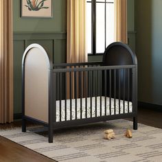 a baby crib in the corner of a room