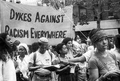 black and white photograph of people protesting against racism