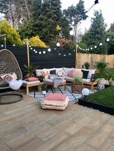 a patio with lots of furniture and lights