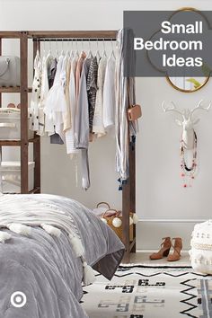 a bedroom with clothes hanging on the rack