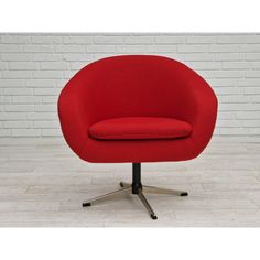 an image of a red chair on the floor