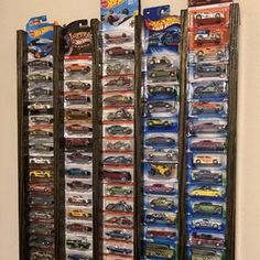 a display case filled with hot wheels and other toy cars