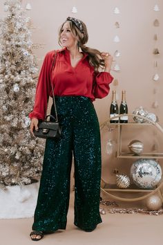 Make a bold and glamorous statement in our Sequins Flared Pants in a stunning peacock hue. These eye-catching pants effortlessly blend flair with festivity, featuring dazzling sequins that catch the light with every step. Embrace the allure and sparkle of these peacock sequined flared pants, ensuring you stand out in the crowd with a touch of extravagance in your Christmas and winter outfits. Sequin pants  Flared  Zip closure  Not lined  Full length  100%POLYESTER Imported  INSEAMS Small - 28.5  Medium - 28.5 Large - 29 XL - 30 1XL - 30 2XL - 30.5 Model Specs: Karli is wearing a size Small. Syd is wearing a size Large in the photo. How will this item fit you? Check out our MODEL SPECS (Typical Sizing - Karli: S-Size 5/26 - 5ft 2in, Emily: S-Size 3/25 - 5ft 5in, Syd: L/XL- Size 15/ - 5ft 8i Sequin Leggings Outfit, Plus Size Christmas Outfit Party, Plus Size Holiday Party Outfit, Christmas Cocktail Party Outfit, Plus Size Christmas Outfit, Company Christmas Party Outfit