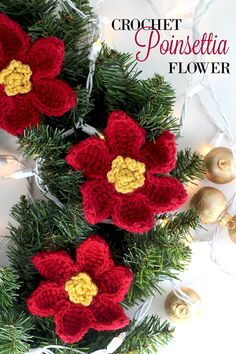 crochet poinsettia flower is hanging from a christmas tree