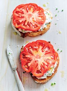 two pieces of bread with tomatoes on them