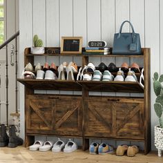 there are many pairs of shoes on top of the wooden shelf in front of the door