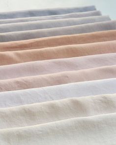 six different colored linens are lined up together