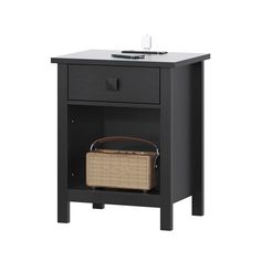 a black night stand with a basket on the bottom and an open drawer underneath it