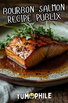 grilled salmon on a plate with sauce and herbs