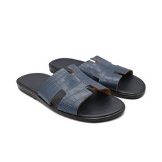 Hermes 'Izmir' sandals in navy blue crocodile leather with an 'H' logo strap, navy blue smooth leather sole, and a dark brown wooden sole. Includes dust bags. Brand = Hermes Size = Men's 42 EU Condition = 8.5/10, Very good. Light wear to soles, slight misshaping in right strap. Material = Crocodile Leather SKU = 23177-46 Hermes Men Sandals, Hermes Izmir, Hermes Ostrich, H Logos, Hermes Men, Crocodile Leather, Sneaker Collection, Outerwear Sweater, Mens Sandals