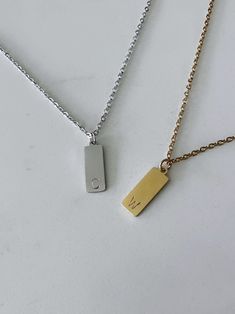 Two (2) personalized rectangle initial pendant necklaces made for everyday wear. Each item is specially hand stamped and personalized to offer a variety of meaning and love to your pieces. All materials are made of stainless steel. Each charm is 15mm x 6mm in dimension. Please message us if you have specific requests for your order. *Please note that each necklace comes with one stamped (1) pendant. If you would like more than one (1) charm on each necklace, please send an inquiry to us on Etsy  How to Order: Step 1 - In the first drop down menu, select the colour and length of the first necklace Step 2- In the second drop down menu, select your colour of choice and length for the second necklace Step 3 - You have the option to personalize your item under the "Add your personalization (opt Boyfriend Initial Necklace Aesthetic, Initial Necklace For Boyfriend, Couple Necklaces Boyfriends, Initial Necklace For Men, Couple Initial Necklace, Necklace For Boyfriend, Boyfriend Initials, Matching Jewelry For Couples, Matching Necklaces For Couples