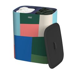 a multicolored box with a black lid and two rolls of toilet paper in it