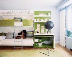 a room with bunk beds and green shelves