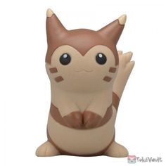 a brown and white cat figurine sitting on its back with it's legs crossed