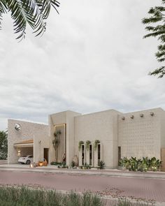 a large white building sitting on the side of a road