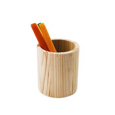 two pencils in a wooden cup on a white background