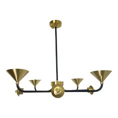 a brass colored chandelier with five lights hanging from it's center point