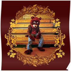 a teddy bear sitting on top of a wooden bench with an ornate frame around it