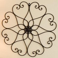 a decorative metal wall hanging on the wall