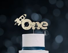 there is a cake that has some type of decoration on it and the word love spelled out in gold