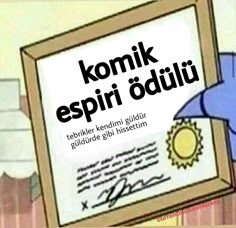 an image of a person writing on a piece of paper with the caption komik espiri oguliu