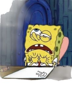 an animated spongebob character sitting at a desk