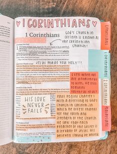 an open bible with the words i corinthians printed on it and some other things