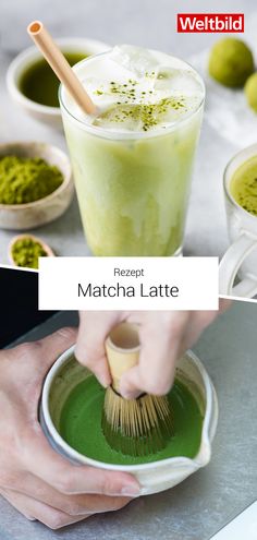 the matcha latte is being stirred with a brush