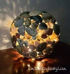 a rock lamp sitting on top of a wooden table