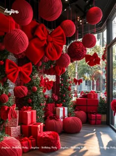 red christmas decorations and presents are hanging from the ceiling