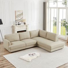 a living room with a sectional couch and rug