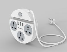 an electrical outlet plugged into a charger with two cords attached to it, on a gray background