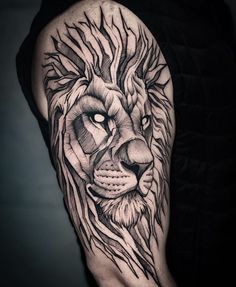 a man's arm with a lion tattoo on it