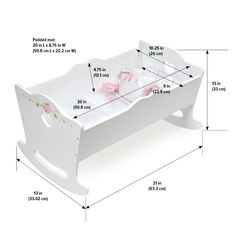 a white wooden doll bed with pink shoes on the bottom shelf and measurements for it