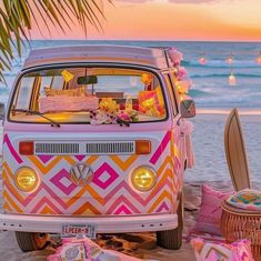 a vw bus parked on the beach with decorations