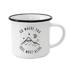 a white and black coffee mug with the words go where you feel most alive