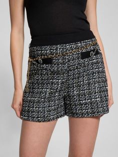 Woven boucle tweed shorts High rise, sits at natural waist Faux front pockets. Back welt pockets. Removable layered chain belt detail Denim waistband Side zip closure 3.25" inseam Measurements taken from a size S 70% Recycled Polyester, 12% Cotton, 9% Viscose/Rayon, 4% Polyamide/Nylon, 2% Metalized Fiber/Metallic, 2% Acrylic, 1% Wool. Contains recycled plastic. Tweed Shorts, Layered Chain, Viscose Rayon, Chain Belt, Denim Details, Welt Pockets, Recycled Plastic, Welt Pocket, Side Zip