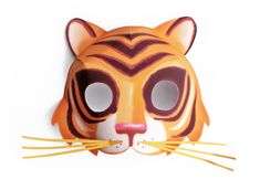 a tiger mask with long yellow sticks sticking out of it's mouth, on a white background