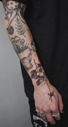 a man's arm with tattoos on it