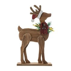 a wooden reindeer ornament with a santa hat