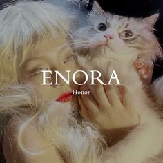 a woman holding a cat in her arms with the caption enora on it